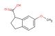 6-methoxy-2,3-dihydro-1H-indene-1-carboxylic acid