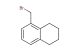 5-(bromomethyl)-1,2,3,4-tetrahydronaphthalene